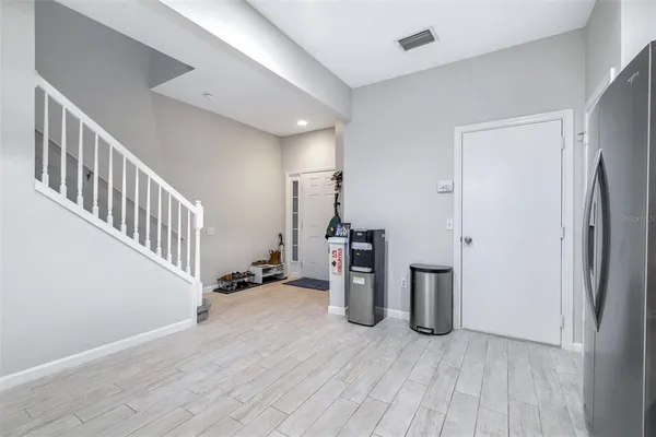 a kitchen with a refrigerator sink and microwave