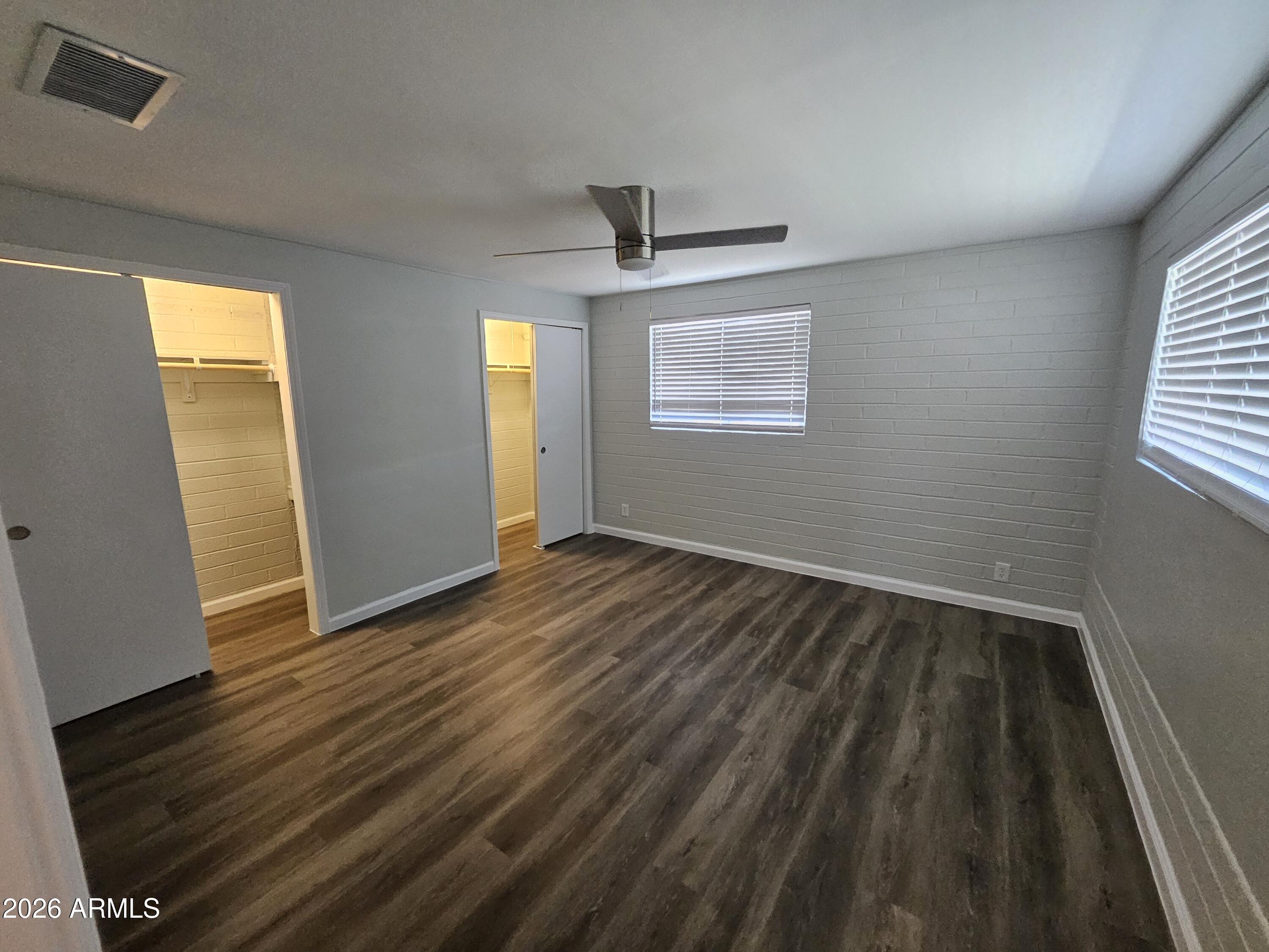 524 West 3rd Place Mesa, AZ 85201 - Photo 9 of 23 wooden floor in an empty room with a window