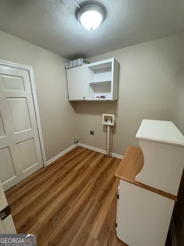 a bedroom with a bed and cabinets