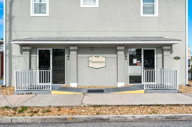 a work room with furniture and wooden floor