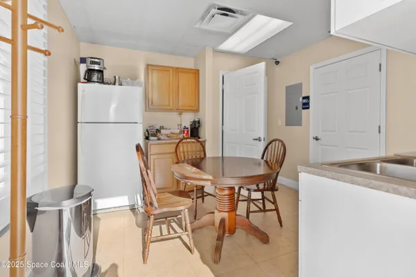 a kitchen with a sink stove and refrigerator