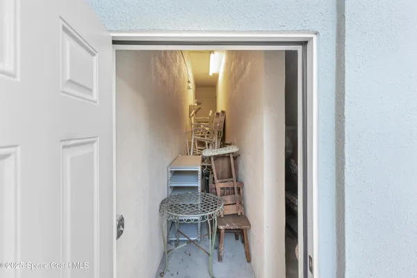 a kitchen with granite countertop a stove microwave and refrigerator
