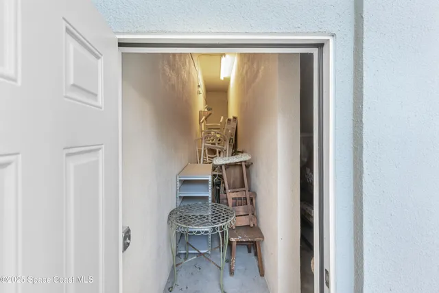 a kitchen with granite countertop a stove microwave and refrigerator