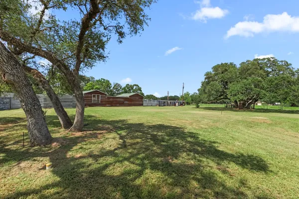 a view of outdoor space with deck and yard