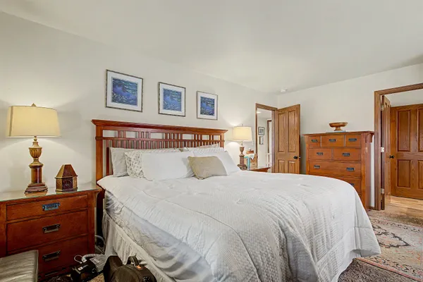 a bedroom with a bed and a closet