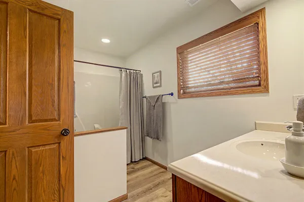 a bathroom with a sink and a shower
