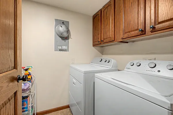 a view of storage and utility room with washer and dryer