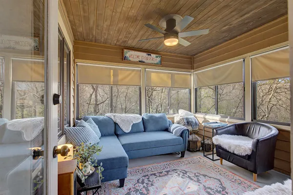 a living room with furniture and a large window