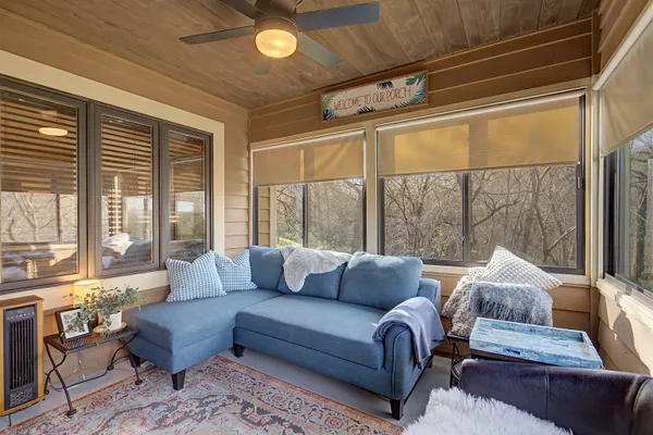a living room with furniture and a large window