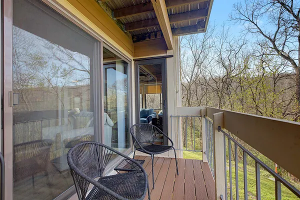 a view of a balcony with furniture