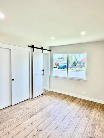 a view of a backyard with of a tree