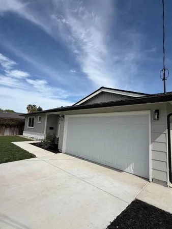 a view of garage with an outdoor space