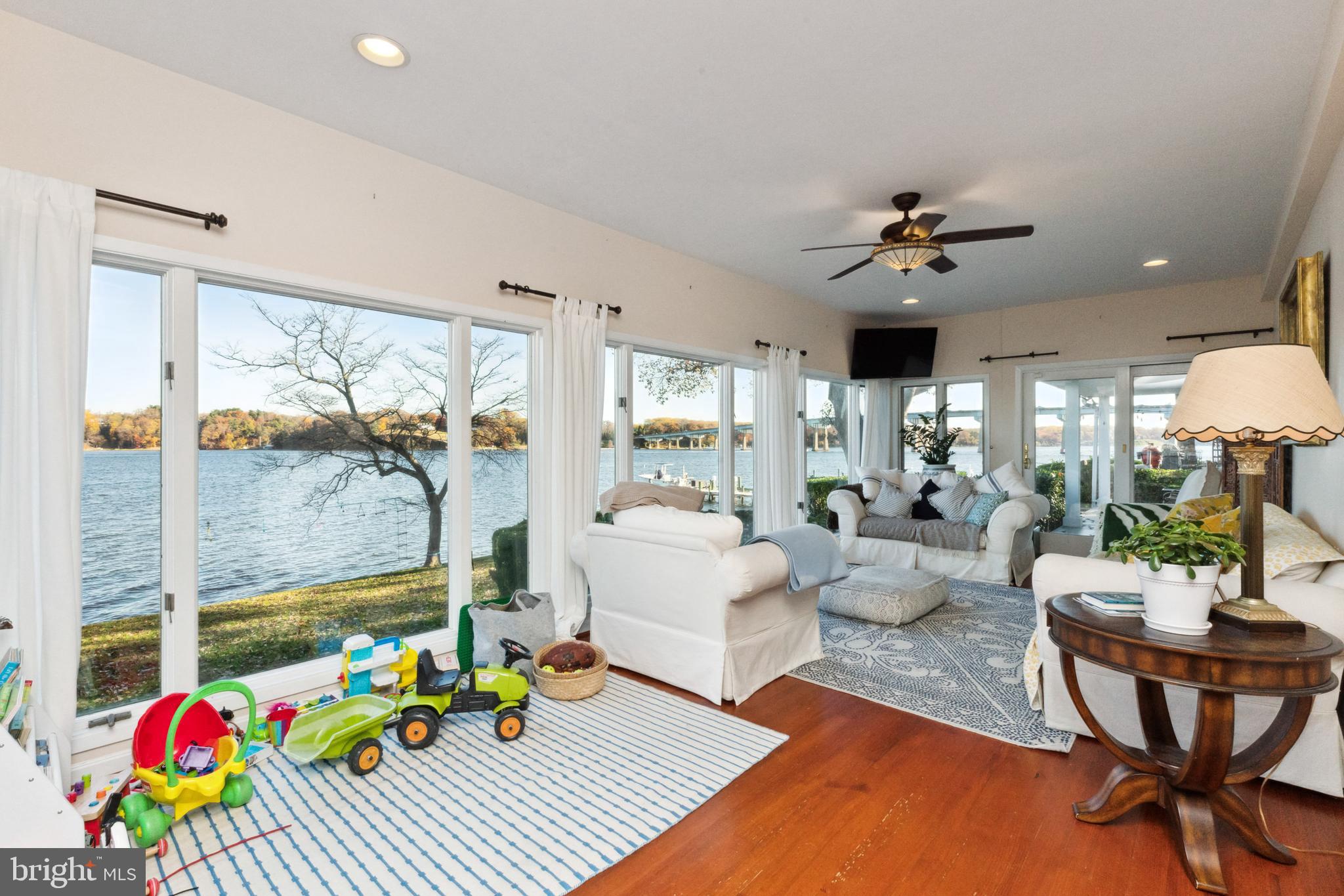1836 Cove Point Road Annapolis, MD 21401 - Photo 10 of 36 Living room features walls of glass for max views