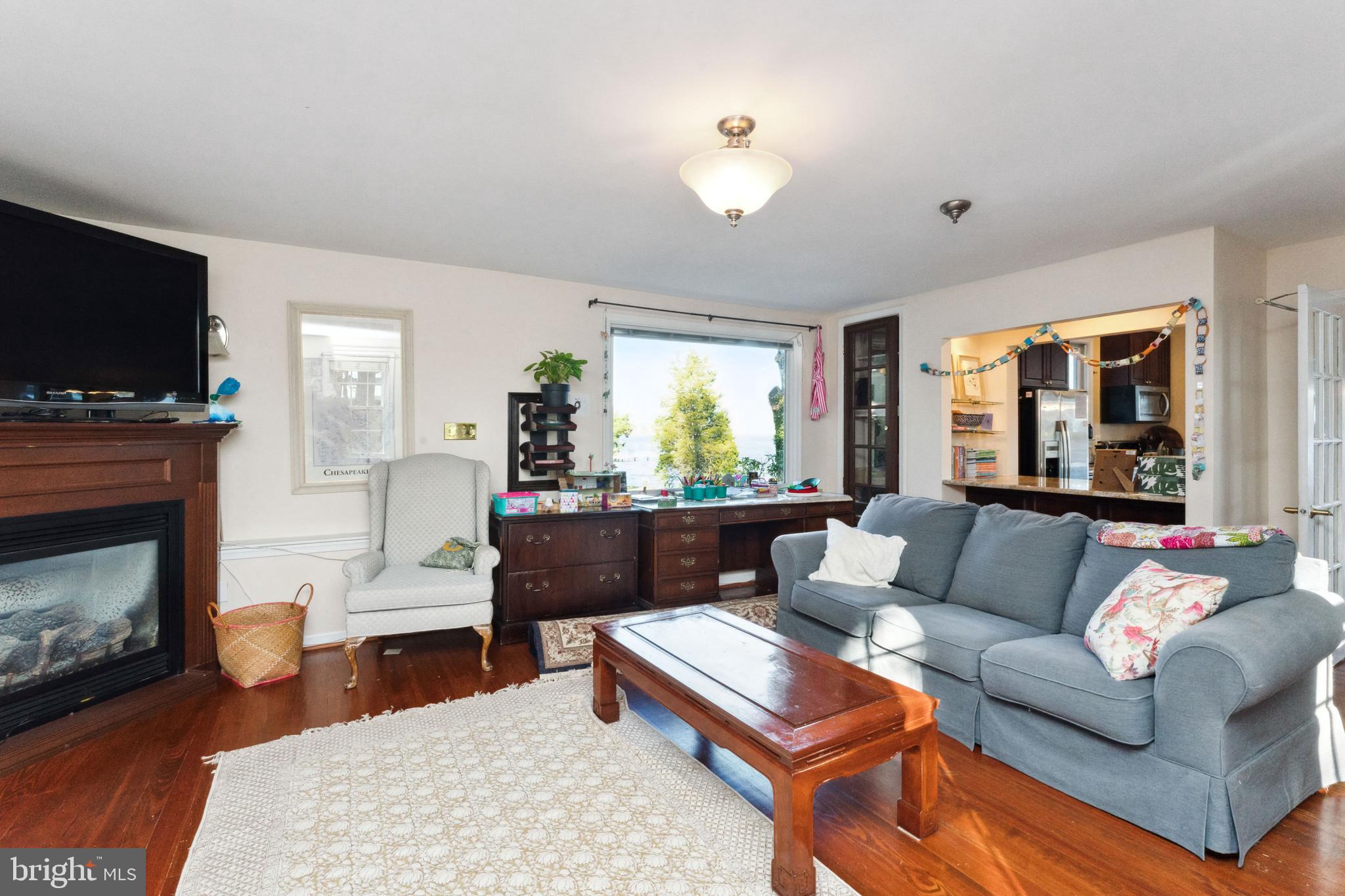 1836 Cove Point Road Annapolis, MD 21401 - Photo 7 of 36 Convenient granite topped bar opens to kitchen