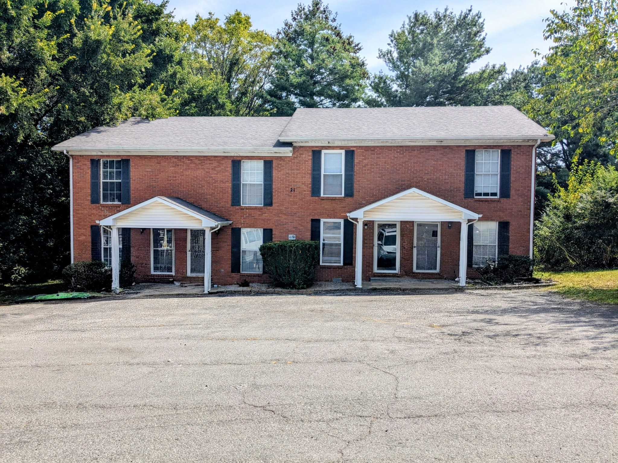 1030 Brookview Drive, Unit 21C Franklin, KY 42134 - Photo 1 of 3 a front view of a house with a yard