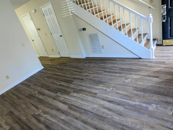 a view of entryway with wooden floor
