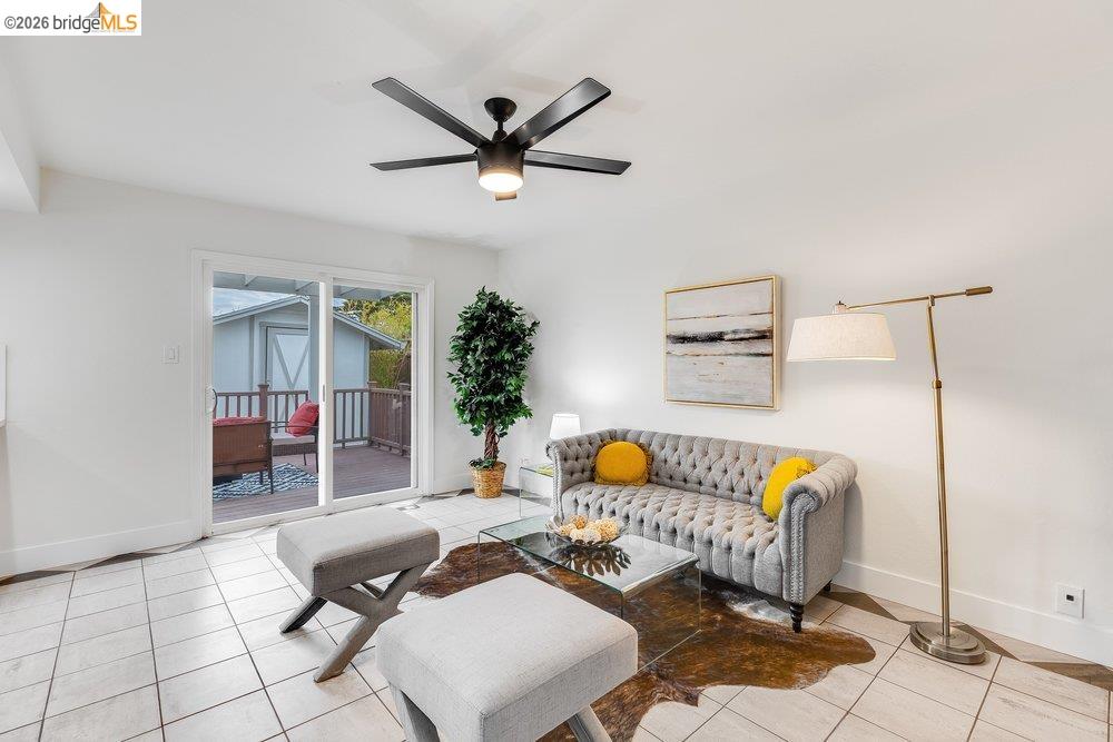 1298 Ribbon Street Foster City, CA 94404 - Photo 35 of 86 Bright living area with white tile flooring and a black ceiling fan