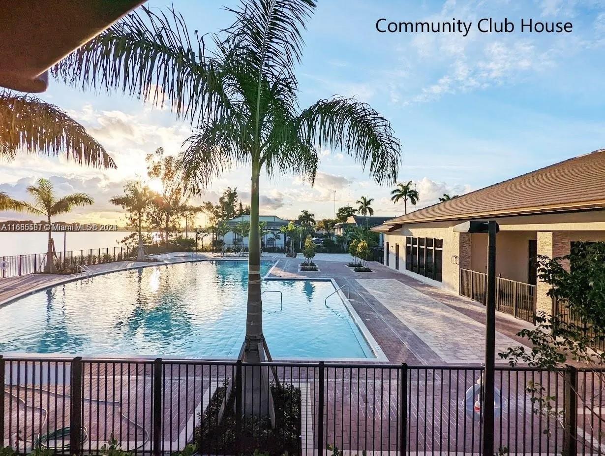 354 Northeast 210th Way Miami, FL 33179 - Photo 5 of 11 a view of a balcony with lake view