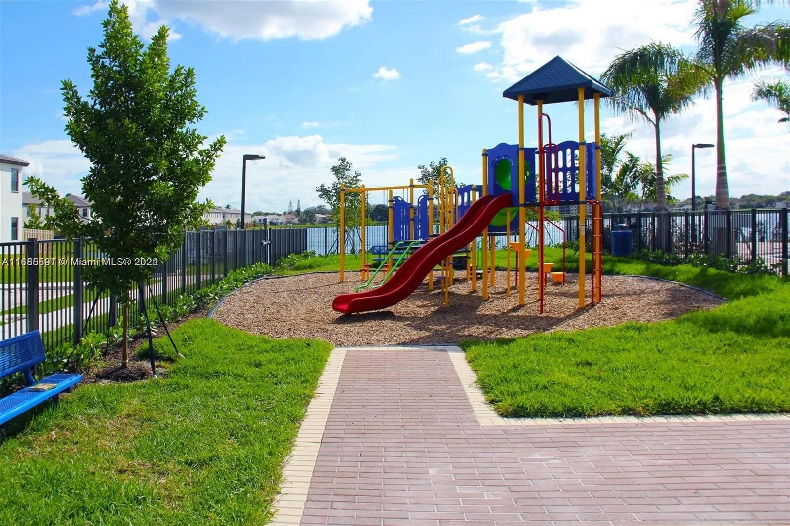354 Northeast 210th Way Miami, FL 33179 - Photo 7 of 11 a view of a park with a slide