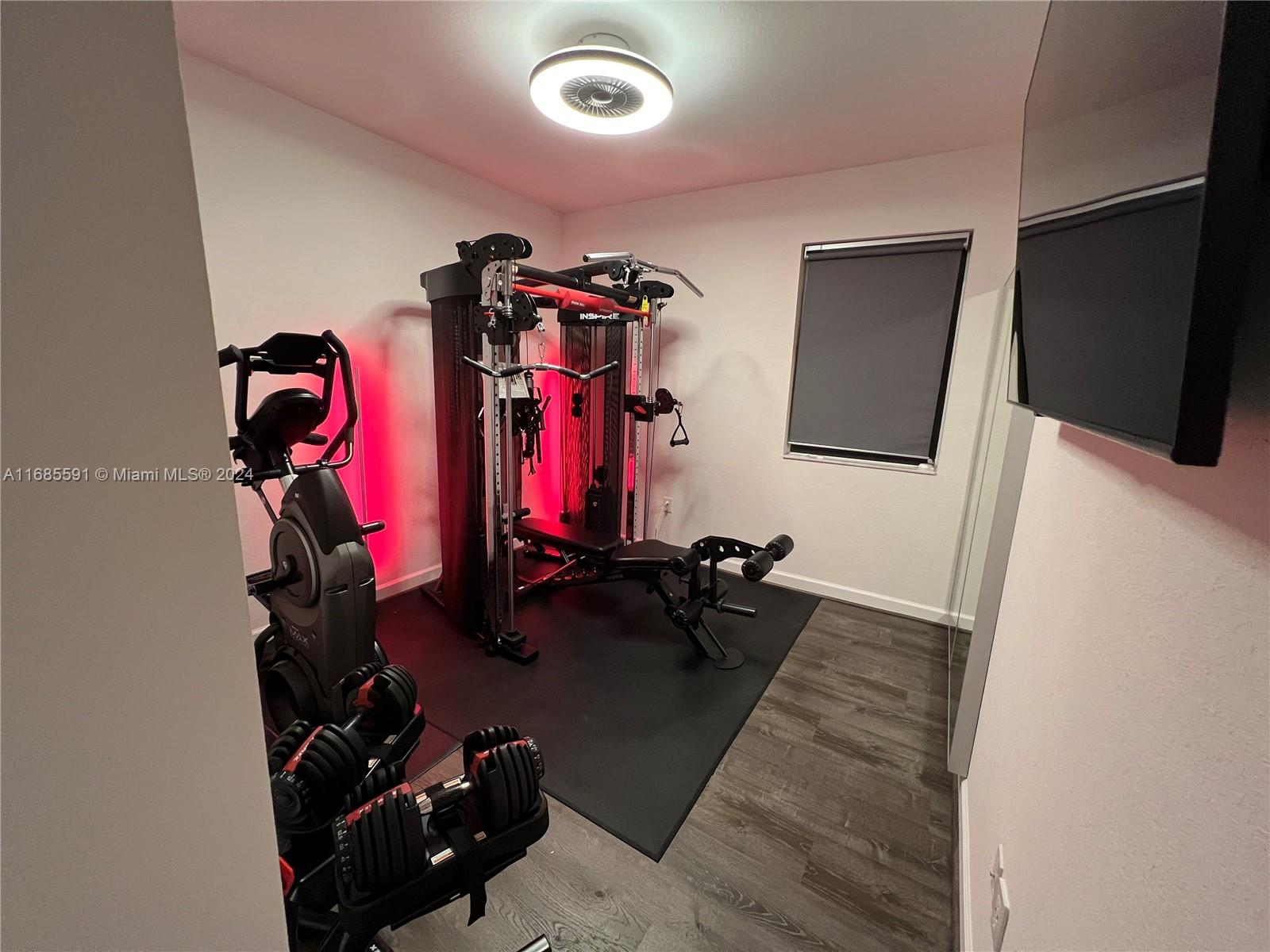 354 Northeast 210th Way Miami, FL 33179 - Photo 8 of 11 a view of a room with gym equipment