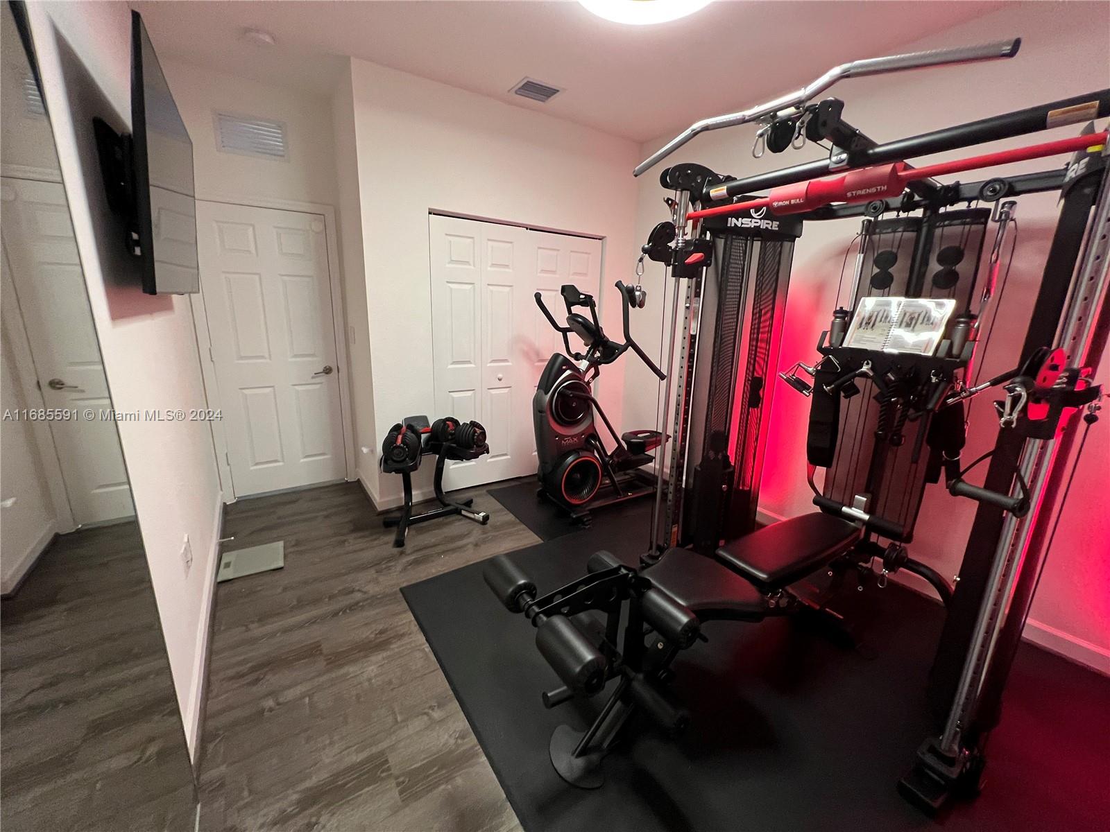 354 Northeast 210th Way Miami, FL 33179 - Photo 9 of 11 a view of a room with gym equipment