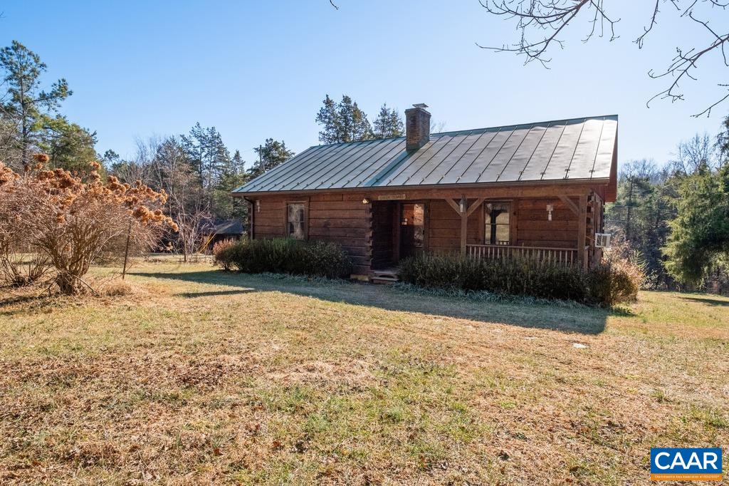 4844 Haden Martin Road Palmyra, VA 22963 - Photo 1 of 40 a front view of a house with a yard and garage