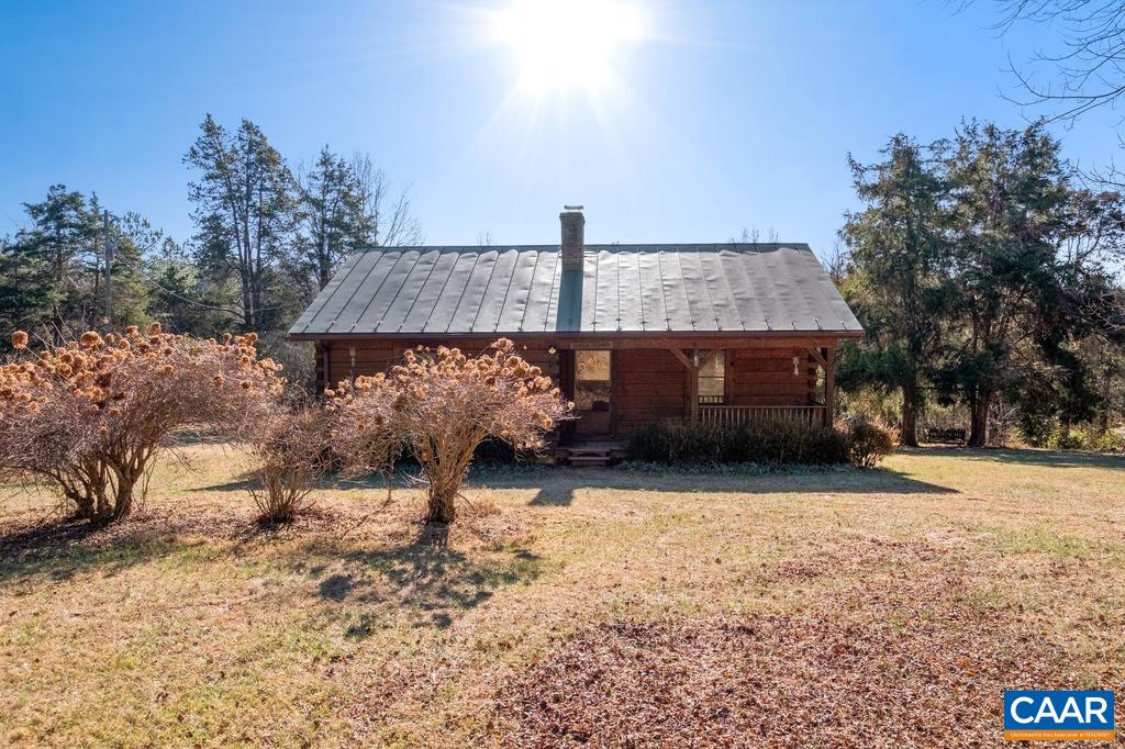4844 Haden Martin Road Palmyra, VA 22963 - Photo 2 of 40 a front view of house with yard and car parked