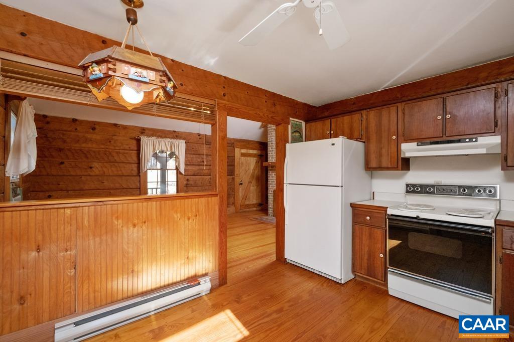 4844 Haden Martin Road Palmyra, VA 22963 - Photo 10 of 40 a view of a kitchen with a stove cabinets and a refrigerator