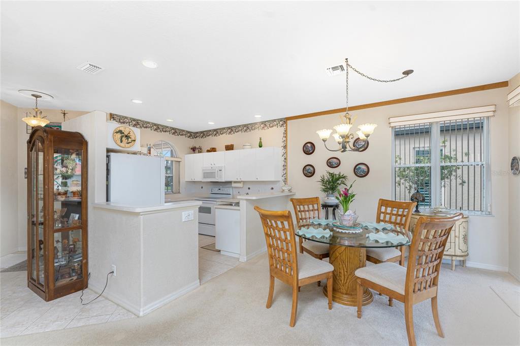10214 Windsong Road Punta Gorda, FL 33955 - Photo 11 of 68 a view of a dining room with furniture