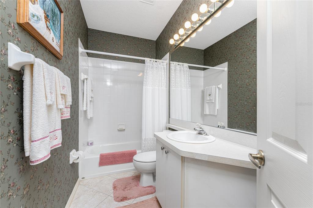 10214 Windsong Road Punta Gorda, FL 33955 - Photo 26 of 68 a bathroom with a double vanity sink mirror and toilet