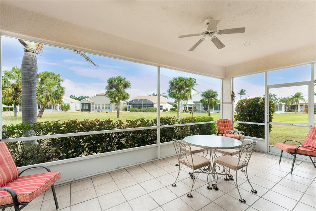 10214 Windsong Road Punta Gorda, FL 33955 - Photo 30 of 68 a view of a chairs and table in a patio