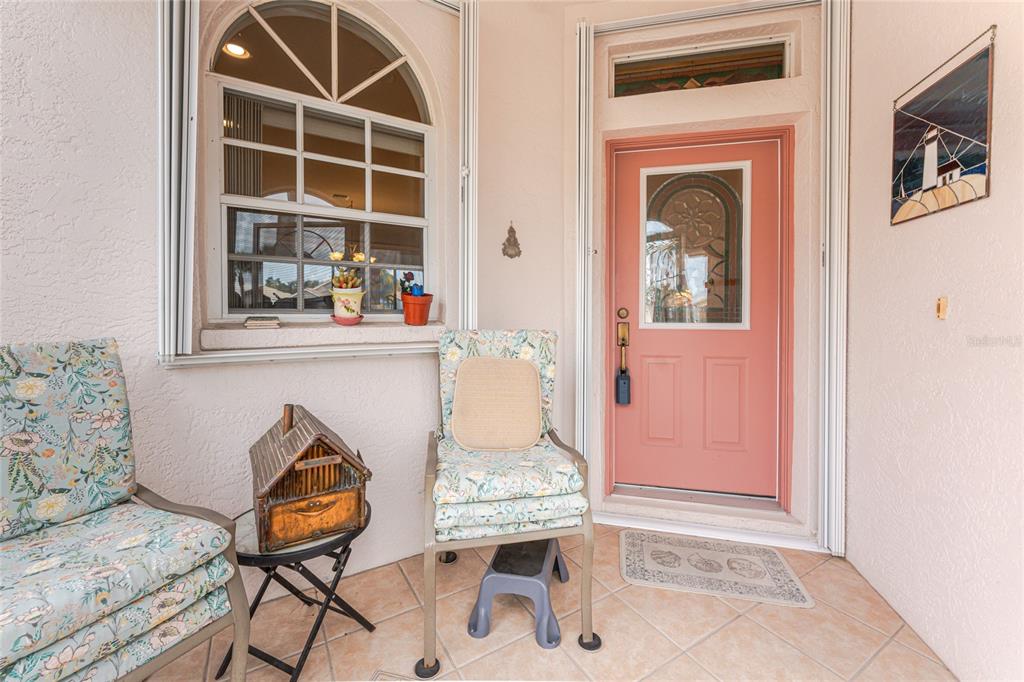 10214 Windsong Road Punta Gorda, FL 33955 - Photo 3 of 68 a view of a livingroom with furniture and a window