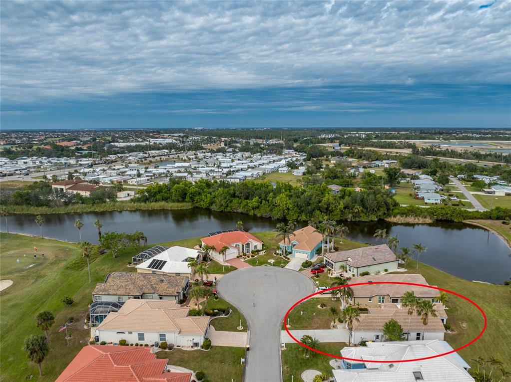 10214 Windsong Road Punta Gorda, FL 33955 - Photo 41 of 68 an aerial view of a house with a lake view