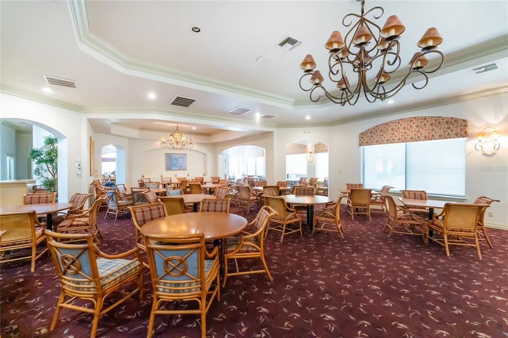 10214 Windsong Road Punta Gorda, FL 33955 - Photo 46 of 68 a group of people sitting at tables in a room