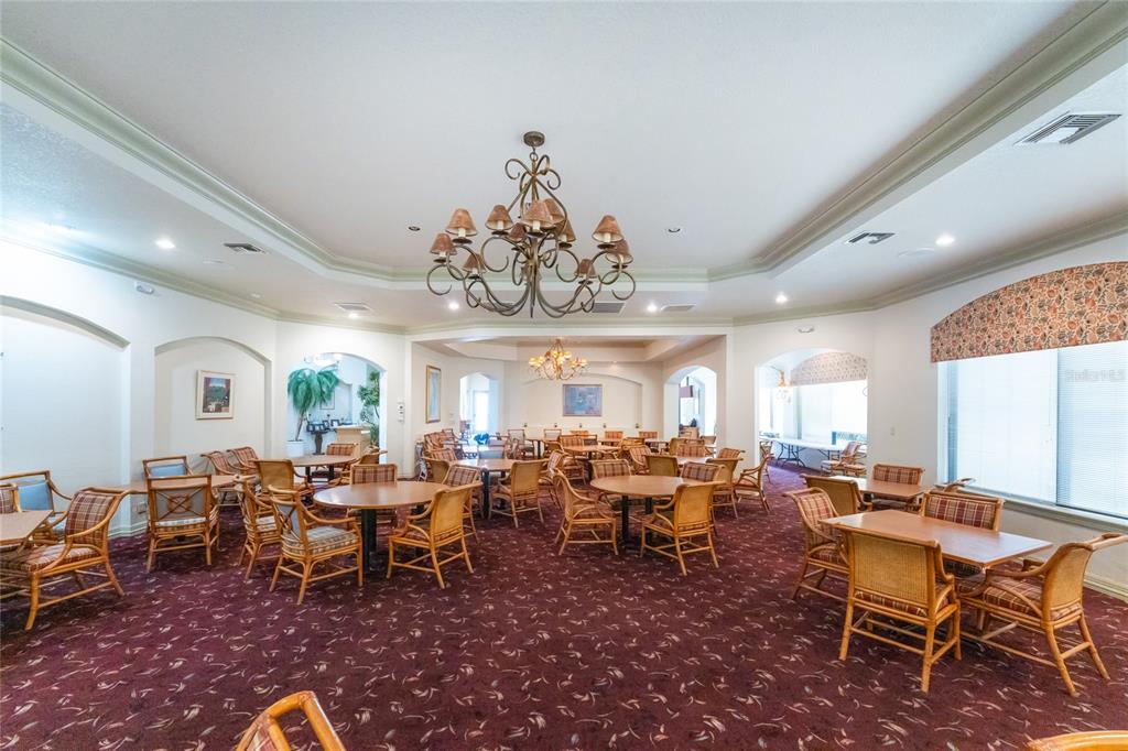 10214 Windsong Road Punta Gorda, FL 33955 - Photo 47 of 68 a view of a dining room with furniture window and wooden floor