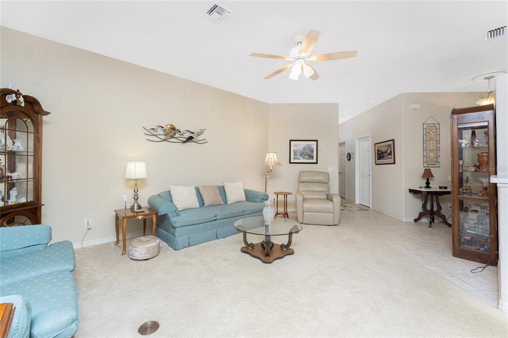 10214 Windsong Road Punta Gorda, FL 33955 - Photo 8 of 68 a living room with furniture and a table