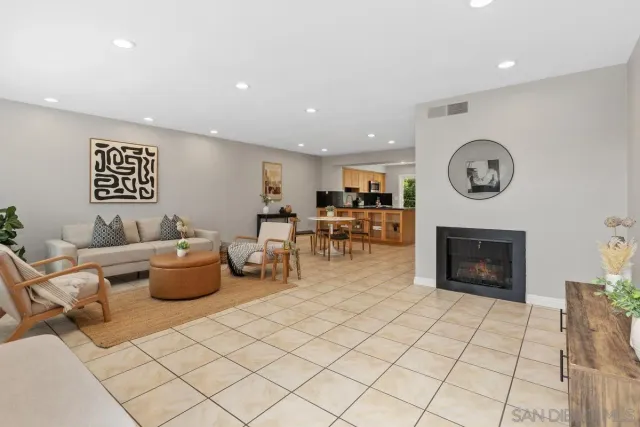 a living room with furniture a fireplace and a fireplace