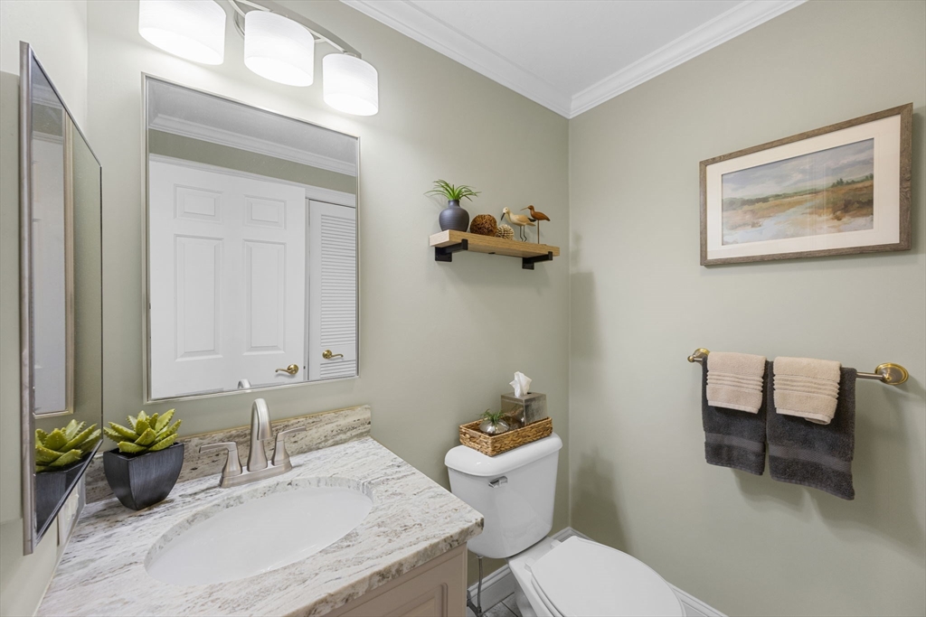 2 Darby Point, Unit 2 Mashpee, MA 02649 - Photo 12 of 42 a bathroom with a toilet a sink and mirror