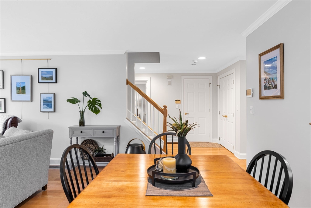 2 Darby Point, Unit 2 Mashpee, MA 02649 - Photo 14 of 42 a view of a livingroom with furniture a ceiling fan and wooden floor