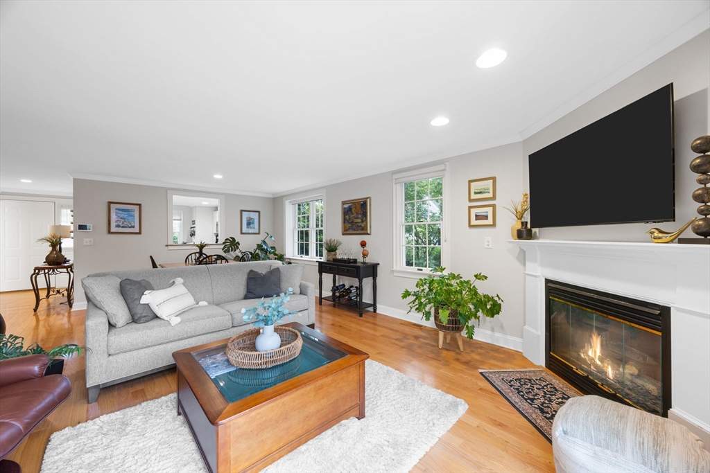 2 Darby Point, Unit 2 Mashpee, MA 02649 - Photo 17 of 42 a living room with furniture a flat screen tv and a fireplace
