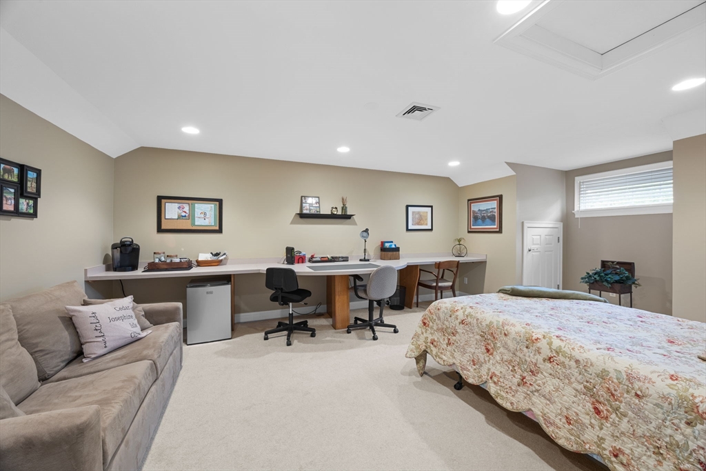 2 Darby Point, Unit 2 Mashpee, MA 02649 - Photo 25 of 42 a bedroom with two beds and a couch