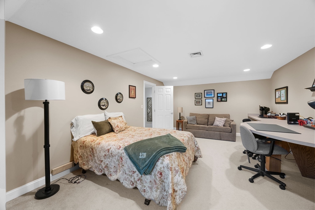 2 Darby Point, Unit 2 Mashpee, MA 02649 - Photo 26 of 42 a bedroom with a bed and a desk