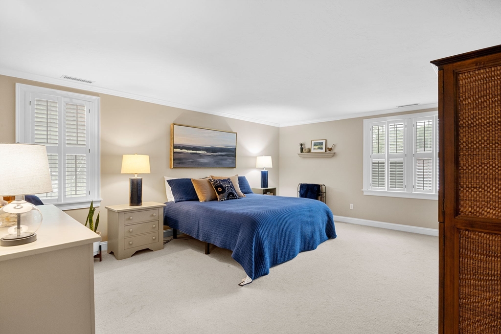 2 Darby Point, Unit 2 Mashpee, MA 02649 - Photo 29 of 42 a bedroom with a bed flat screen tv and window