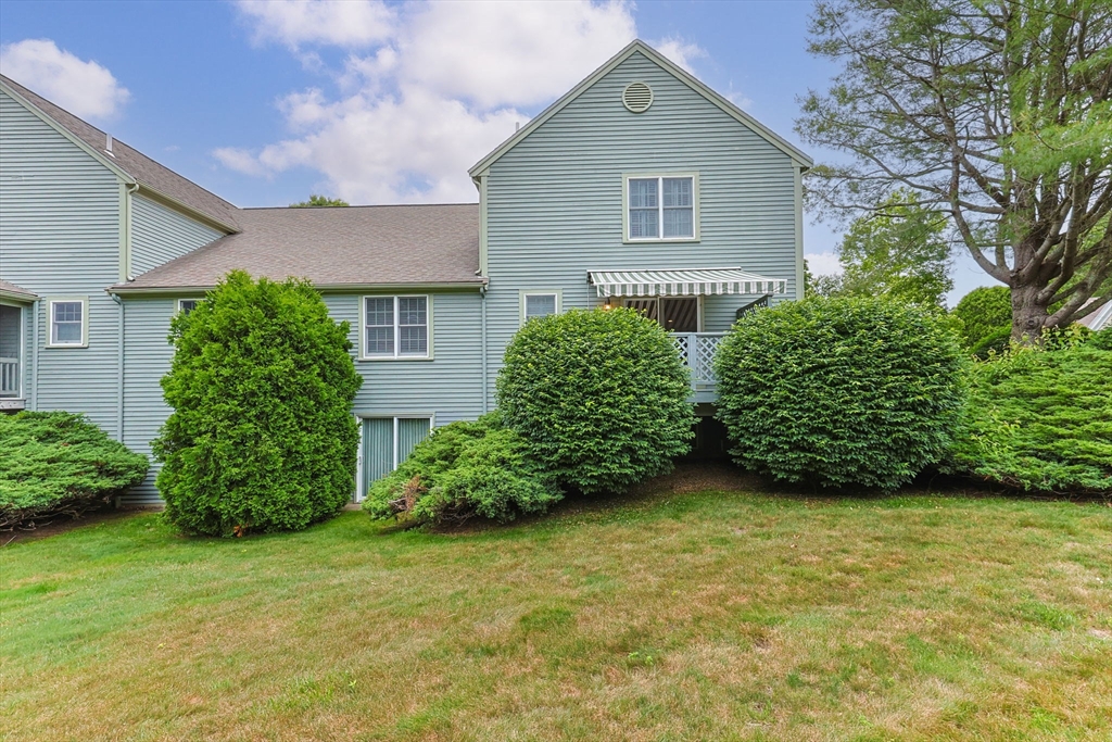 2 Darby Point, Unit 2 Mashpee, MA 02649 - Photo 36 of 42 front view of a house with potted plants and a yard