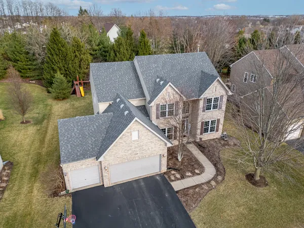 an aerial view of a house with garden space