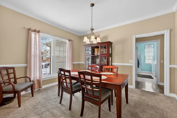 a view of a dining room with furniture