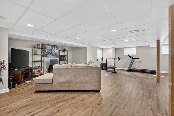 a living room with furniture and flat screen tv