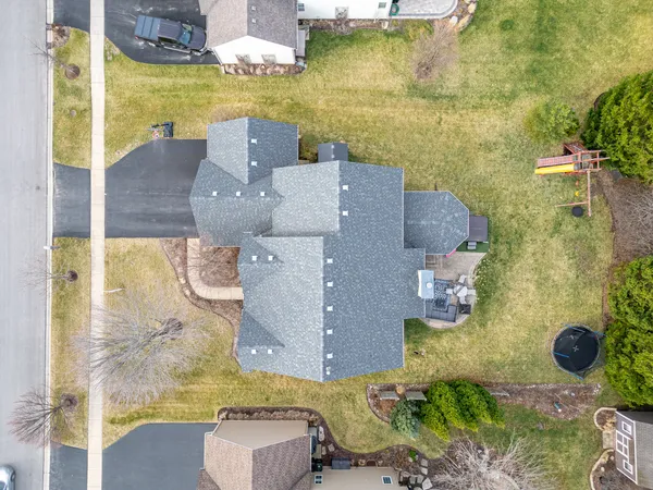 an aerial view of residential houses with outdoor space