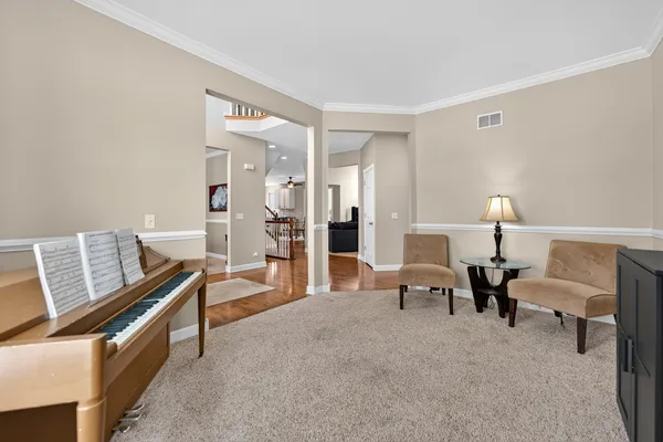 a living room with furniture and two lamps