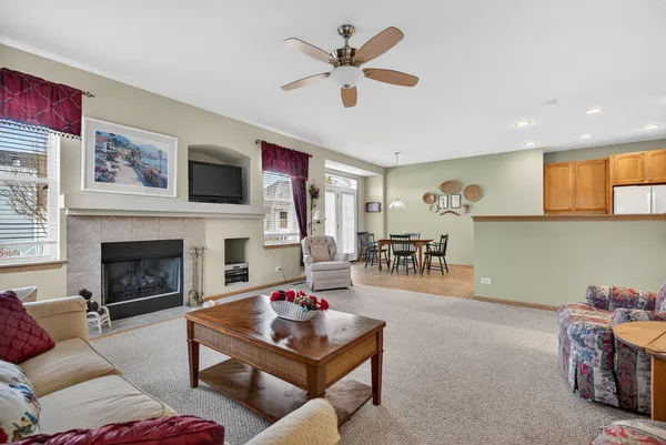 a living room with furniture and white walls